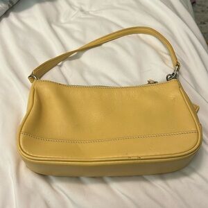 Yellow leather Coach small purse.